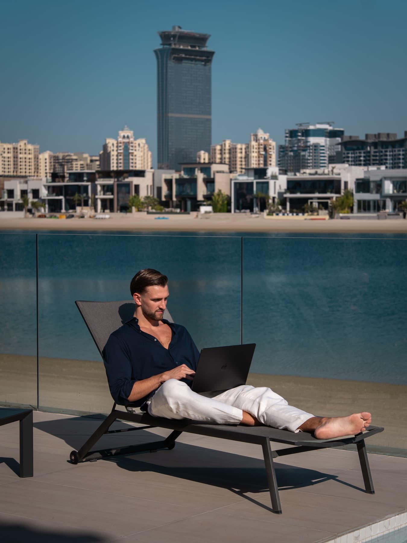 Kilian Kropiunik working poolside at Palm Jumeirah, shot by Viraly
